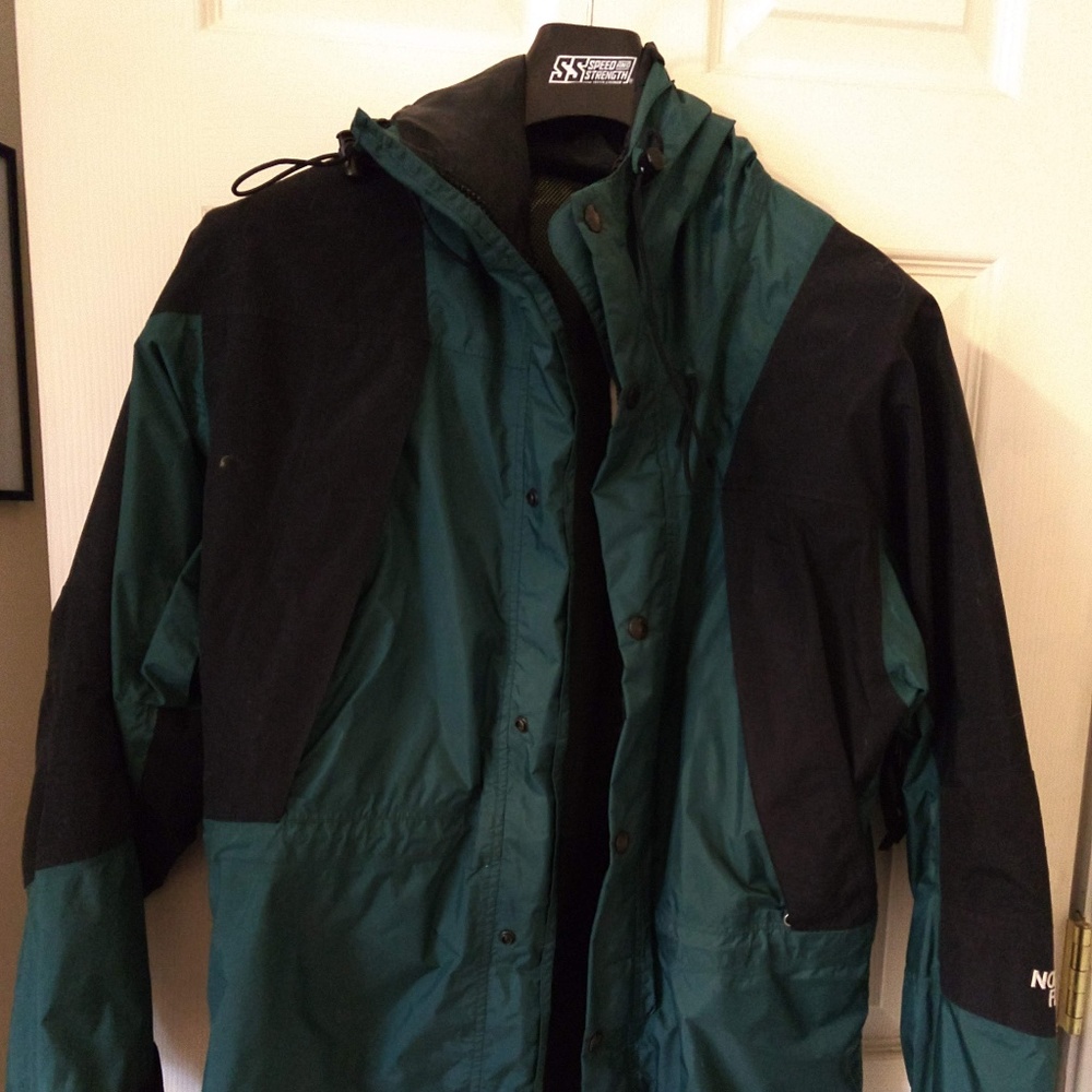 Green North Face rain coat medium